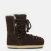 Botas Evx de gamuza y piel de oveja en marrón oscuro Botas Evx de gamuza y piel de oveja en marrón oscuro